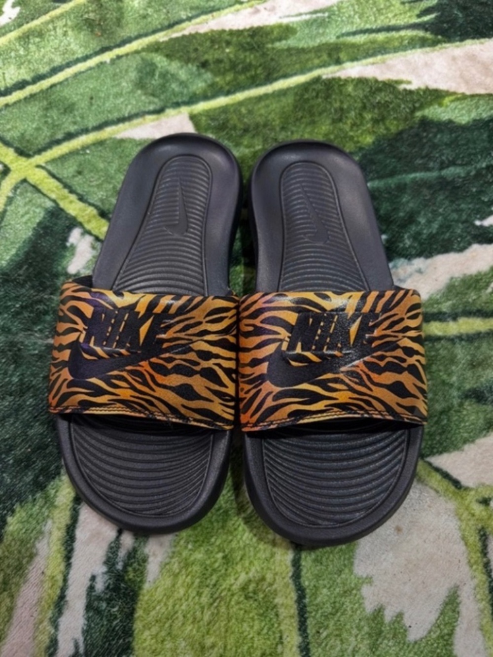 Nike Women's Black Slides with Orange Tiger-Print Strap